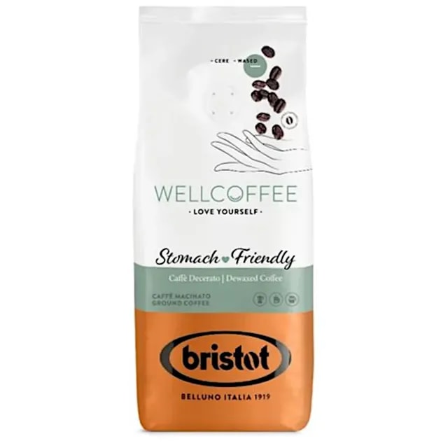 Opakowanie kawy Wellcoffee, oznaczonej jako przyjazna dla żołądka, z widocznymi ziarenkami kawy w tle. Doskonały wybór dla osób szukających łagodnego smaku kawy, idealny do codziennego parzenia i delektowania się aromatem.