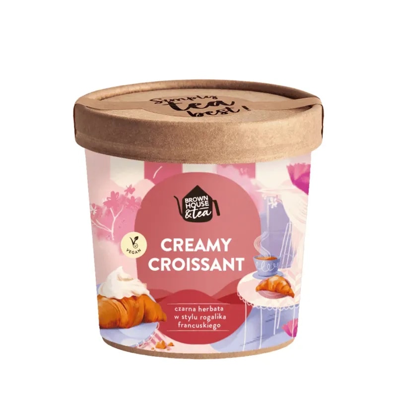 Opakowanie herbaty "Creamy Croissant" przedstawia aromatyczną czarną herbatę inspirowaną francuskim rogalikiem. Idealna na każdą porę dnia, ta wegańska herbata wprowadza subtelny smak i elegancję do Twojej filiżanki.