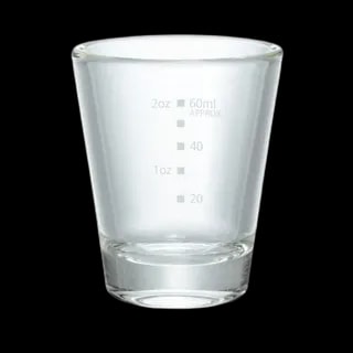 Przezroczysta szklanka do espresso Hario o pojemności 80 ml, z precyzyjną podziałką ułatwiającą odmierzanie porcji kawy. Wykonana z wysokiej jakości szkła odpornego na temperaturę, idealna do serwowania espresso i precyzyjnego parzenia kawy.