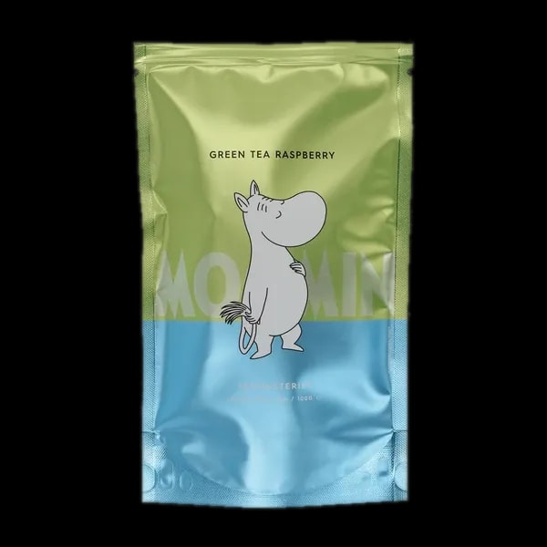 Opakowanie herbaty sypanej Teministeriet Moomin Green Tea Raspberry, 100g, z uroczym motywem Muminka. Zielona herbata o owocowym aromacie malin, idealna do codziennego relaksu. Wyjątkowa mieszanka inspirowana światem Muminków, łącząca świeżość zielonej herbaty z delikatną słodyczą malin.