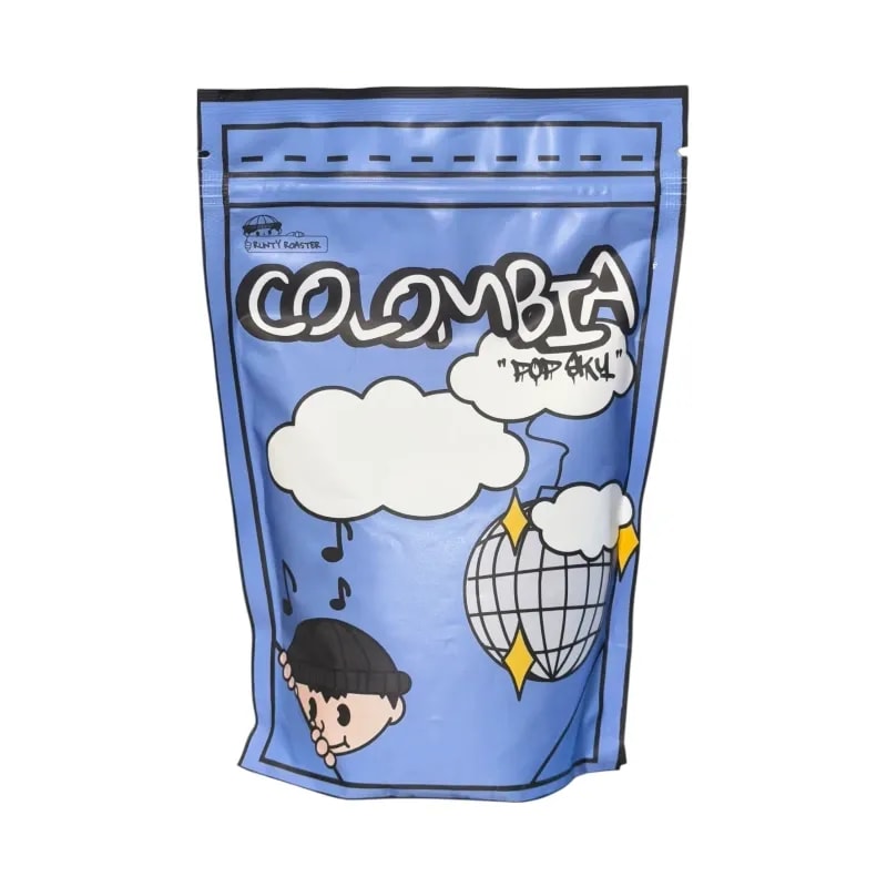 Opakowanie mielonej kawy Colombia Popsky 250g z kolorową grafiką, idealne do parzenia aromatycznego napoju. Produkt wysokiej jakości, pochodzący z Kolumbii, doskonały dla miłośników wyjątkowych smaków kawowych.