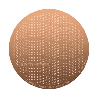 Innowacyjny filtr stalowy do AeroPress, wykonany z stali nierdzewnej 316, zapewnia idealne parzenie kawy. Pokrycie tytanowe gwarantuje wytrzymałość i doskonałą filtrację, idealny dla miłośników aromatycznej kawy.