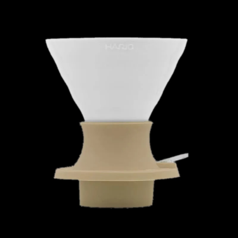 Ceramiczny dripper Hario V60 Immersion Switch w kolorze Smokey White, idealny do precyzyjnego parzenia kawy metodą przelewową. Wyposażony w innowacyjny mechanizm immersion switch, pozwala na pełną kontrolę nad czasem ekstrakcji. Doskonały wybór dla baristów i miłośników kawy speciality, którzy cenią sobie bogaty smak i aromat.