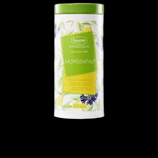 Biała puszka z herbatą Ronnefeldt Tea Couture Morgentau o pojemności 100 g. Delikatna zielona herbata Sencha z Chin, aromatyzowana smakiem mango i cytrusów, idealna na letnie popołudnia.