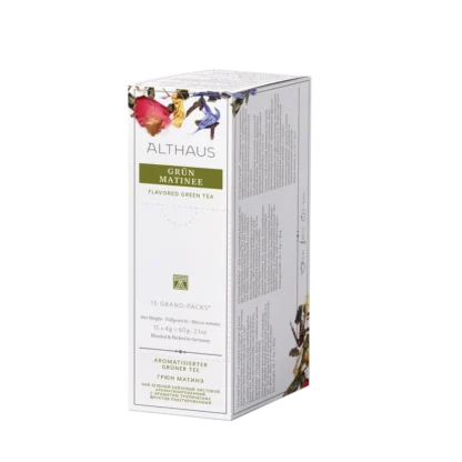 Opakowanie herbaty Althaus Grün Matinée, aromatyzowana zielona herbata, zawierające 15 większych saszetek, z eleganckim zielono-białym designem i wyraźnymi obrazami suszonych kwiatów, wyprodukowane w Niemczech