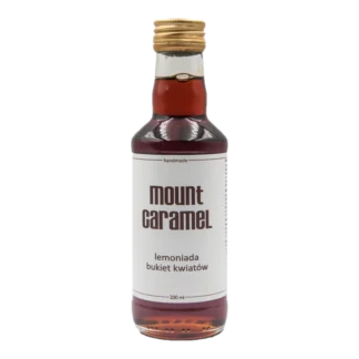 Mała przezroczysta butelka z ciemną lemoniadą 'Bukiet Kwiatów' Mount Carmel, ręcznie robiona, o pojemności 200 ml, z białą etykietą informującą o smaku i marce