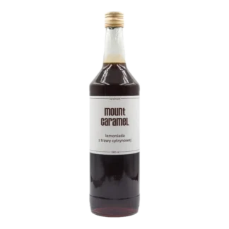 Duża przezroczysta butelka z ciemną lemoniadą 'z Trawy Cytrynowej' Mount Carmel, ręcznie robiona, o pojemności 1000 ml, z białą etykietą informującą o smaku i marce