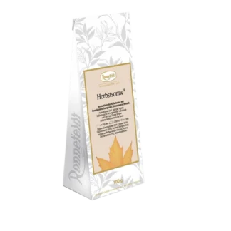 Opakowanie herbaty ziołowej Ronnefeldt Herbstsonne o aromacie przypraw i cytrusów. Herbata w eleganckiej, ozdobnej białej torebce, zawierającej 100 g herbaty ziołowej idealnej na chłodne, jesienne dni.