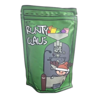 Runty Claus kawa świąteczna specialty 250g – zielone opakowanie z motywem świątecznym, aromatyczna kawa ziarnista idealna do alternatywnych metod parzenia, espresso i świątecznych przepisów kawowych.