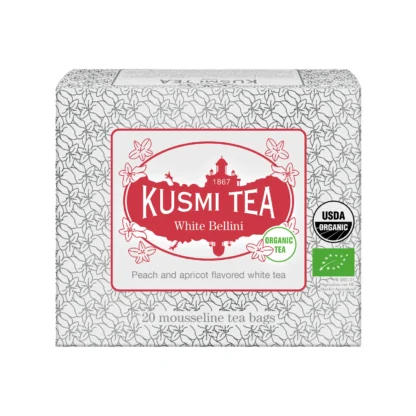 Pudełko Kusmi Tea White Bellini z 20 ekologicznymi saszetkami białej herbaty o smaku brzoskwini i moreli, z czerwonym logo i kwiatowym wzorem.
