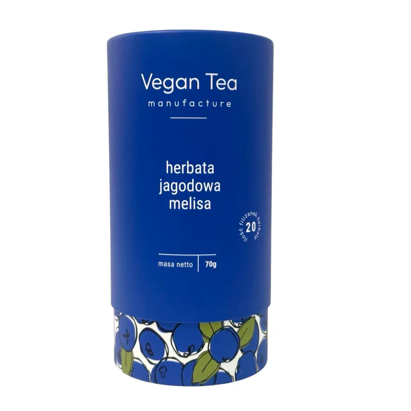 Granatowe, cylindryczne opakowanie herbaty Vegan Tea z ilustracją jagód przy podstawie. Na froncie biały napis: „herbata jagodowa melisa, masa netto 70g, 20 filiżanek naparu”. Naturalna mieszanka z nutą owocową i uspokajającą melisą.