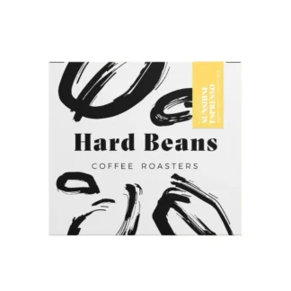 Opakowanie 250g kawy ziarnistej Hard Beans Kolumbia Sunshine Espresso z nutami mango, karmelu i ciemnego cukru – idealna do espresso, dostępna w sklepie Coffee Selection.
