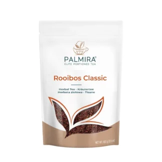 Opakowanie herbaty rooibos Classic marki Palmira, zawierające 100g aromatycznej mieszanki. Idealna do parzenia w domu, ta herbata ziołowa jest doskonałym wyborem dla miłośników zdrowego stylu życia i relaksu.